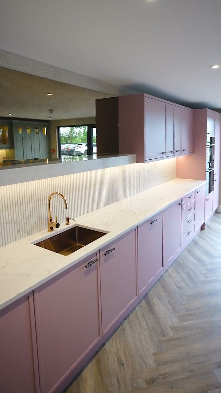 A handmade CEK kitchen with copper sink and marble worktop