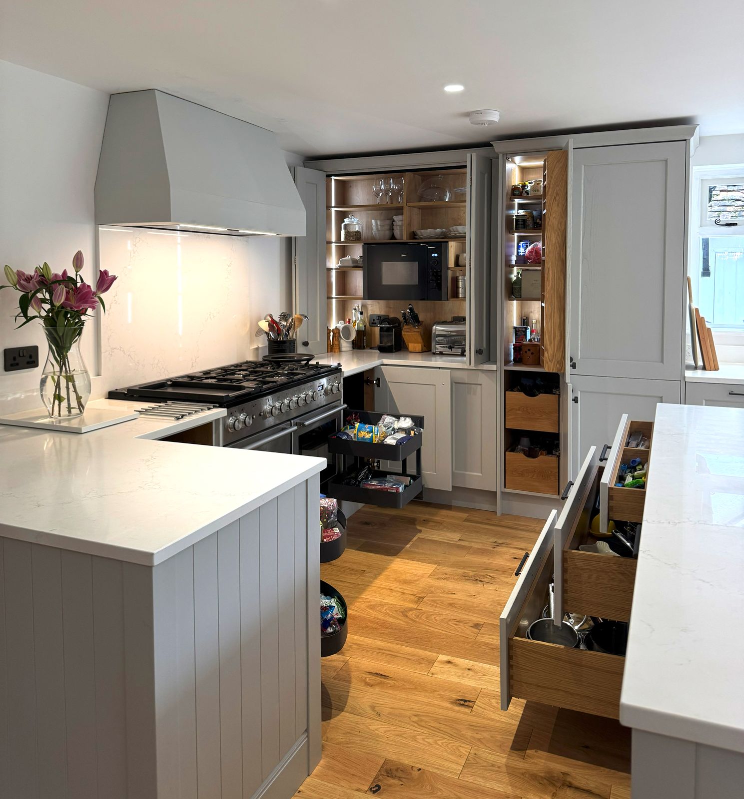 The breakfast cupboard and larder open, with an oak pull-out drawer