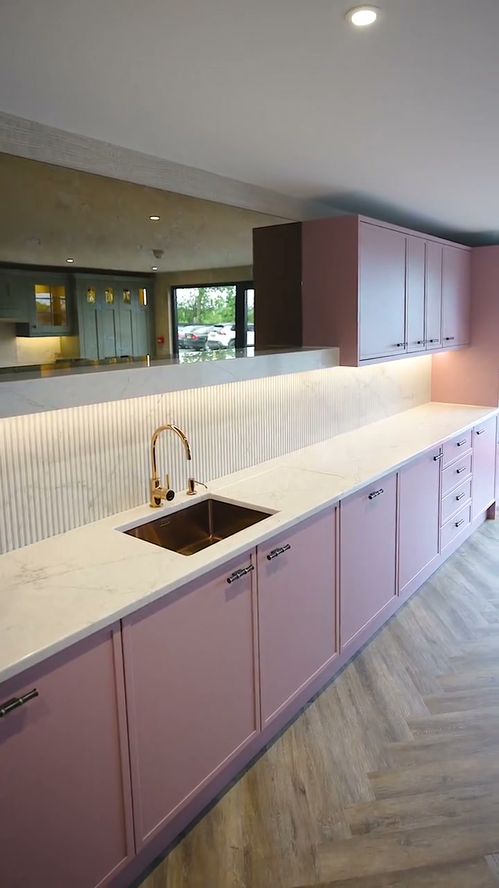 A handmade CEK kitchen with copper sink and marble worktop